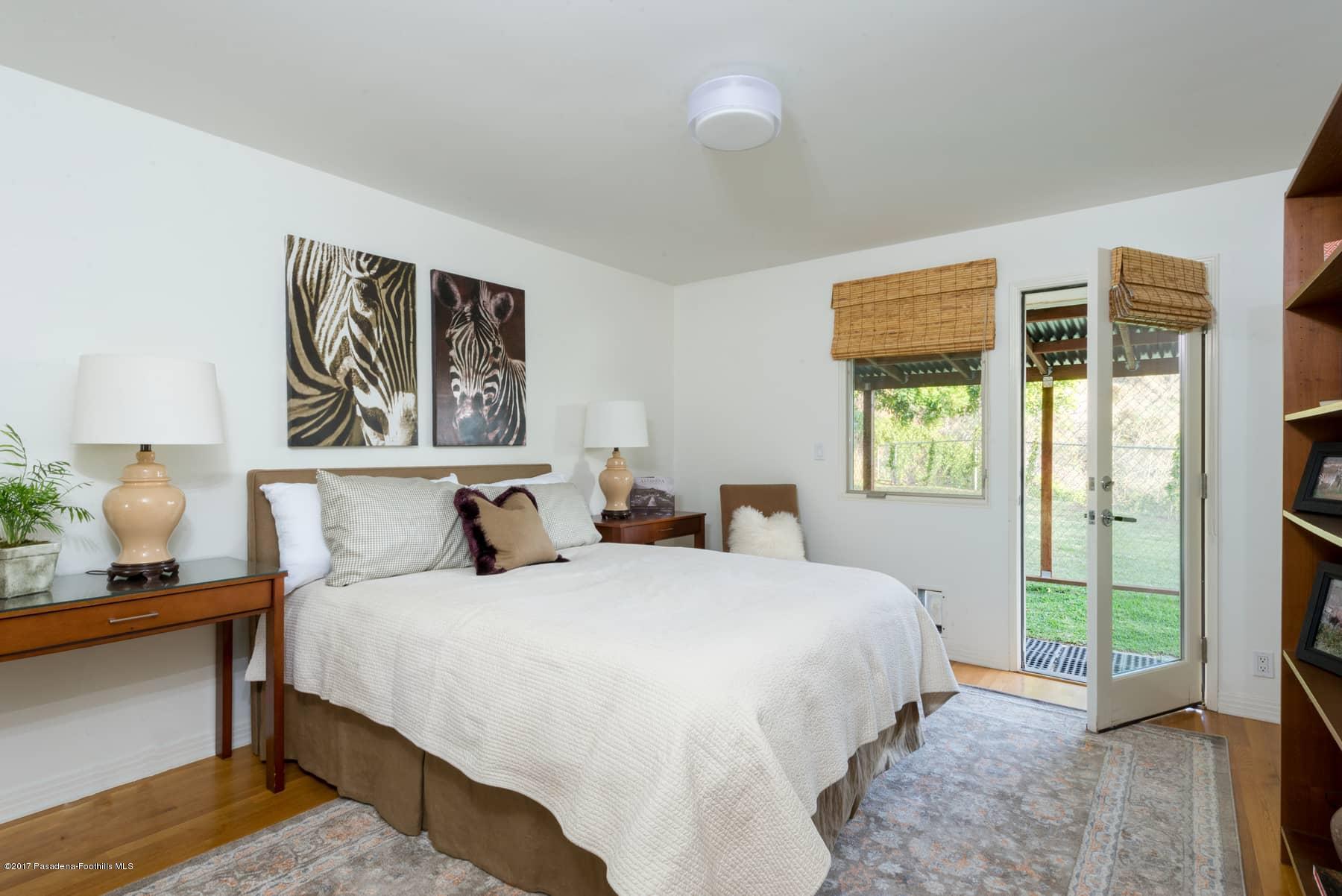 3430 Ellington Villa Drive Altadena, CA 91001 - Photo 26 of 49 a bedroom with a bed and a window