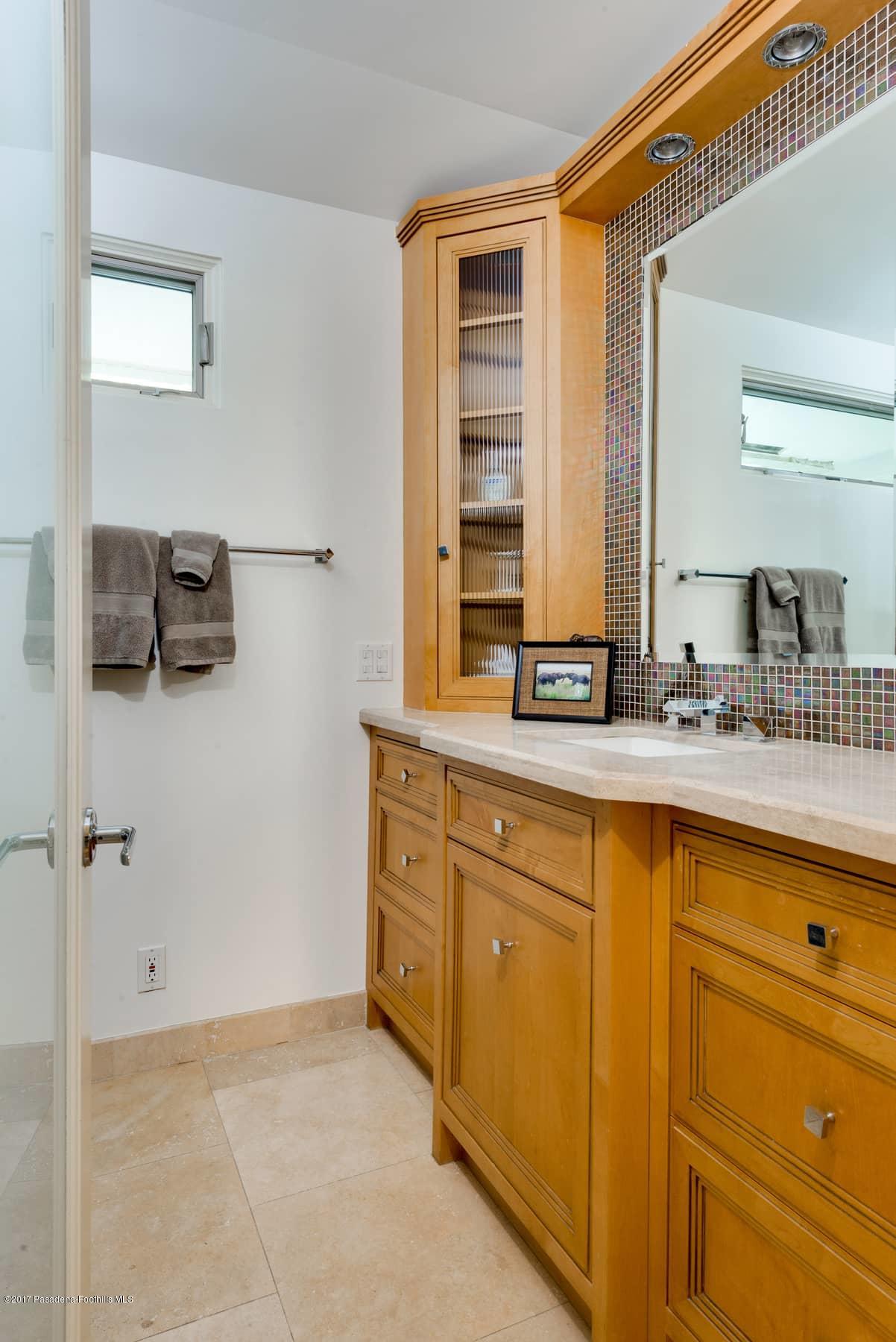 3430 Ellington Villa Drive Altadena, CA 91001 - Photo 28 of 49 a bathroom with a sink and a mirror