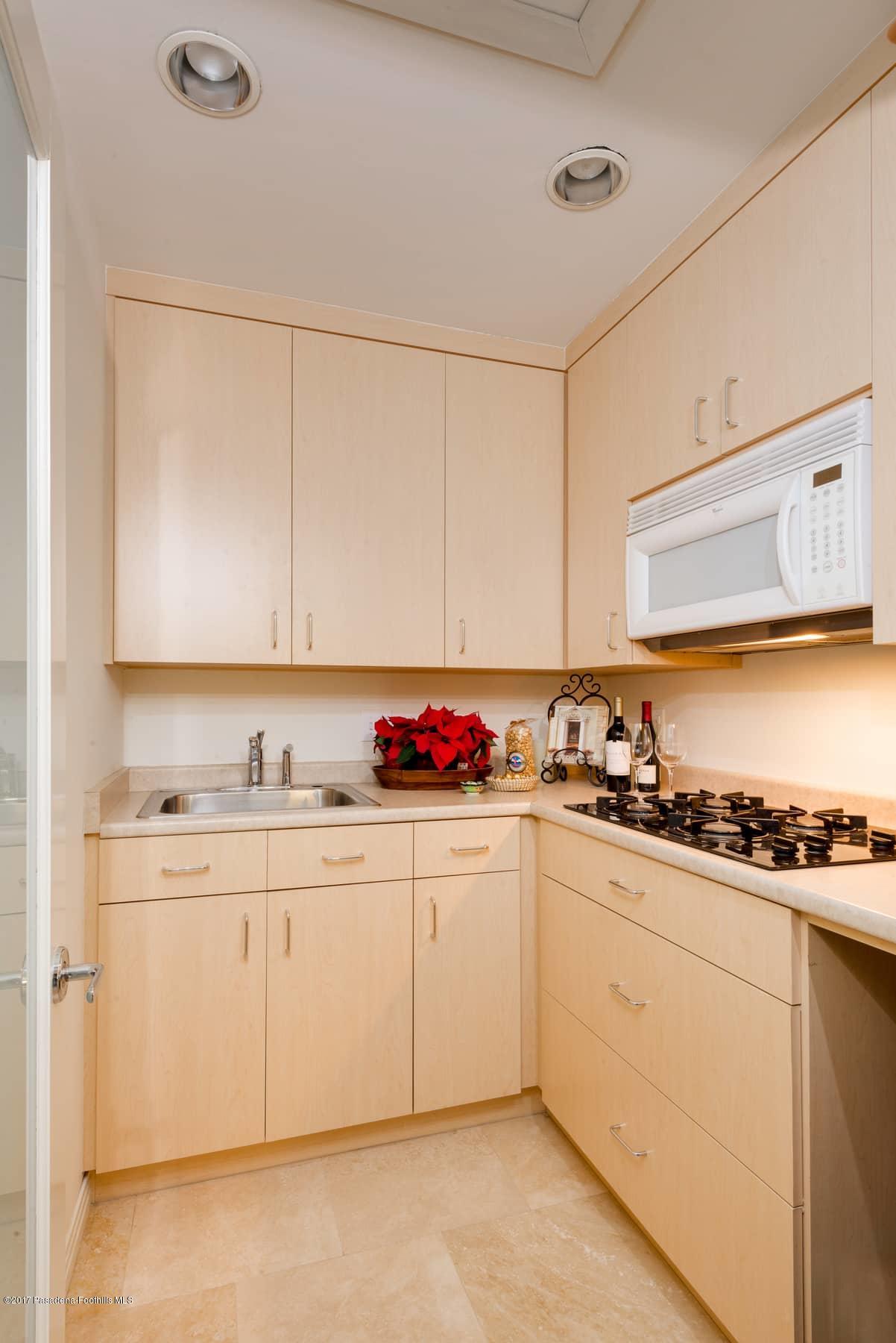 3430 Ellington Villa Drive Altadena, CA 91001 - Photo 30 of 49 a kitchen with sink a stove and cabinets