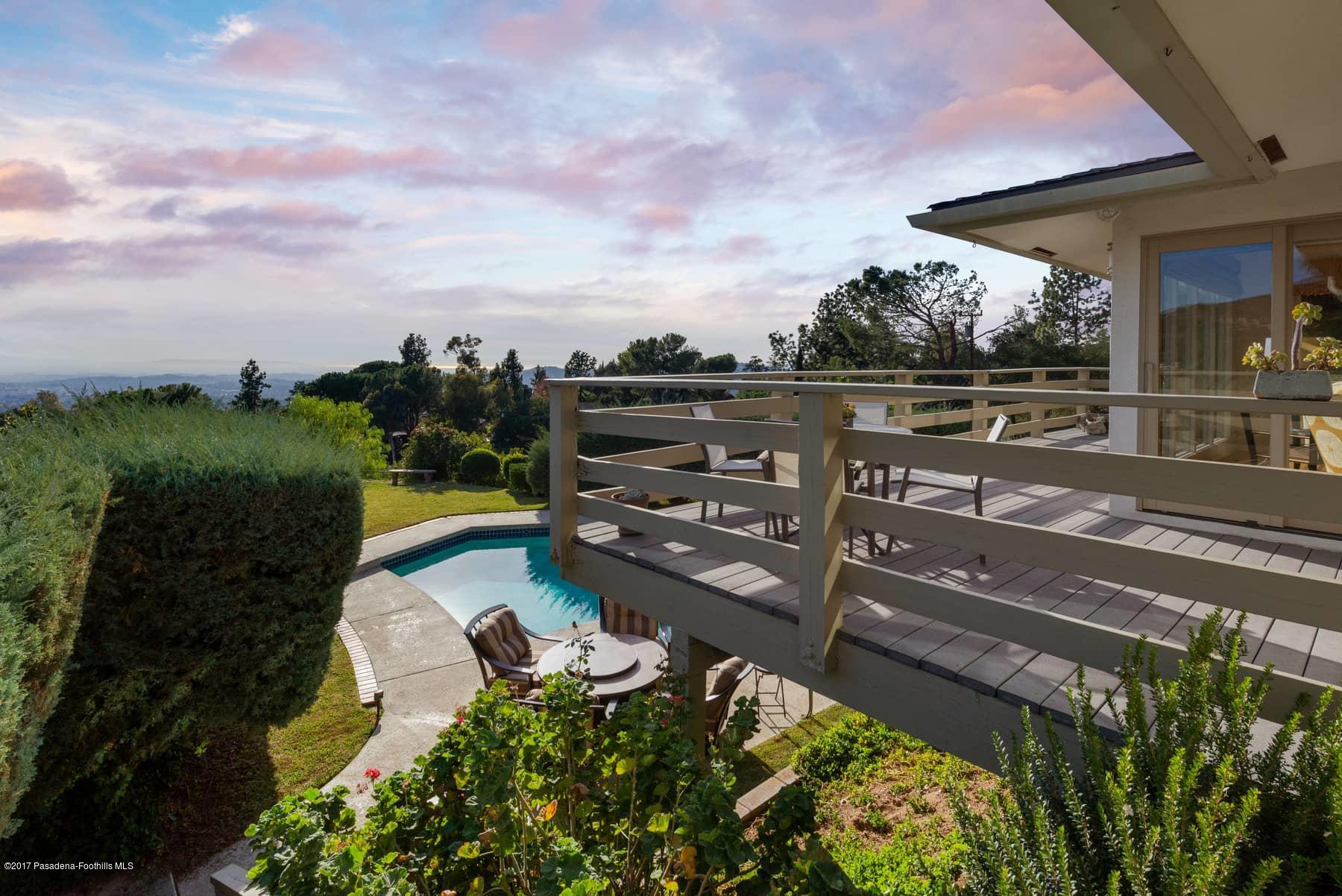 3430 Ellington Villa Drive Altadena, CA 91001 - Photo 32 of 49 a view of a lake with a floor to ceiling window next to a yard