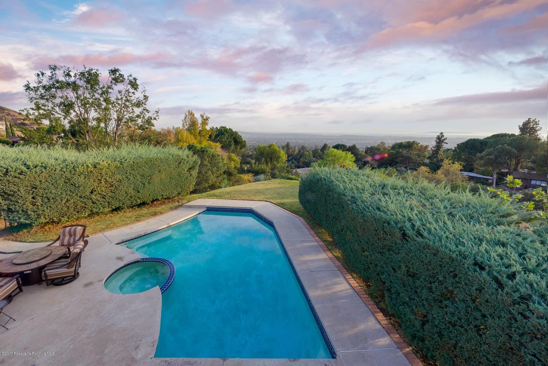 3430 Ellington Villa Drive Altadena, CA 91001 - Photo 38 of 49 a view of a swimming pool with a yard and mountain view in back