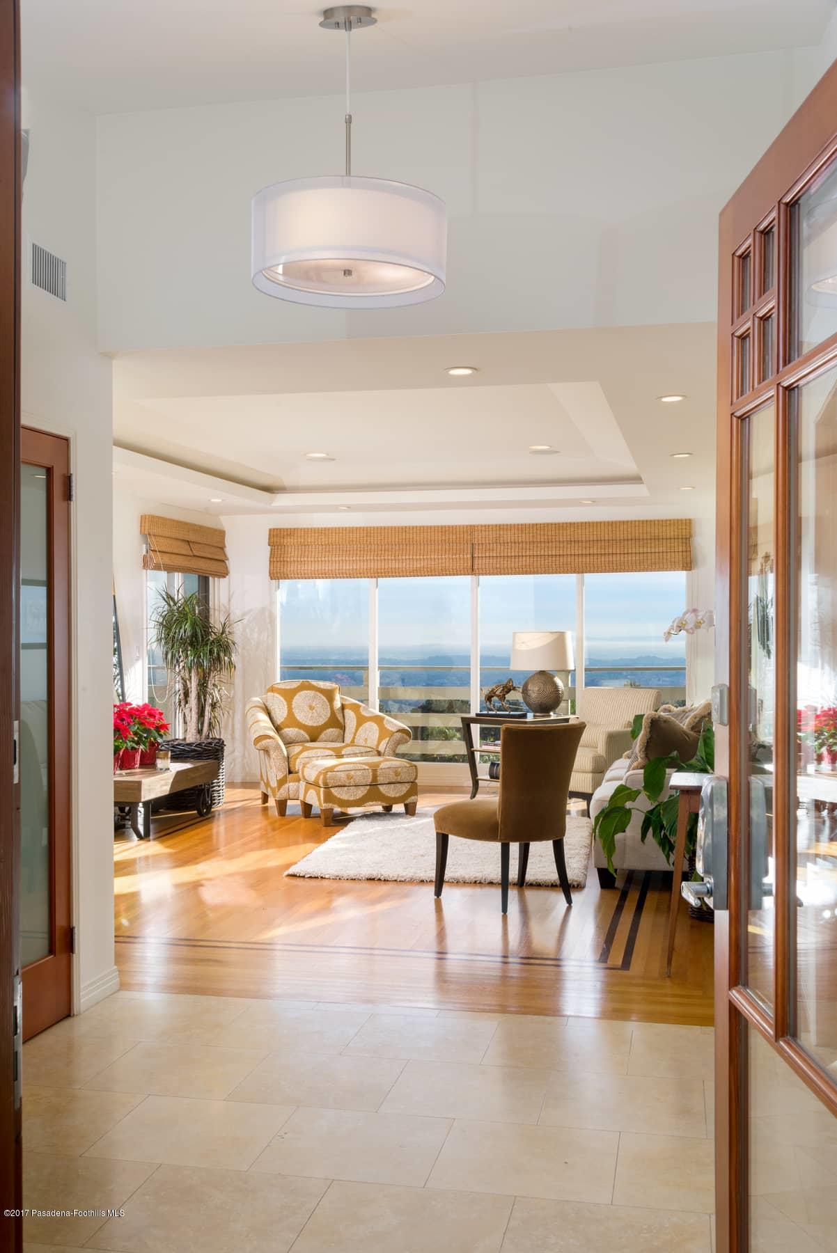 3430 Ellington Villa Drive Altadena, CA 91001 - Photo 4 of 49 a view of a living room with hardwood floor and floor to ceiling windows