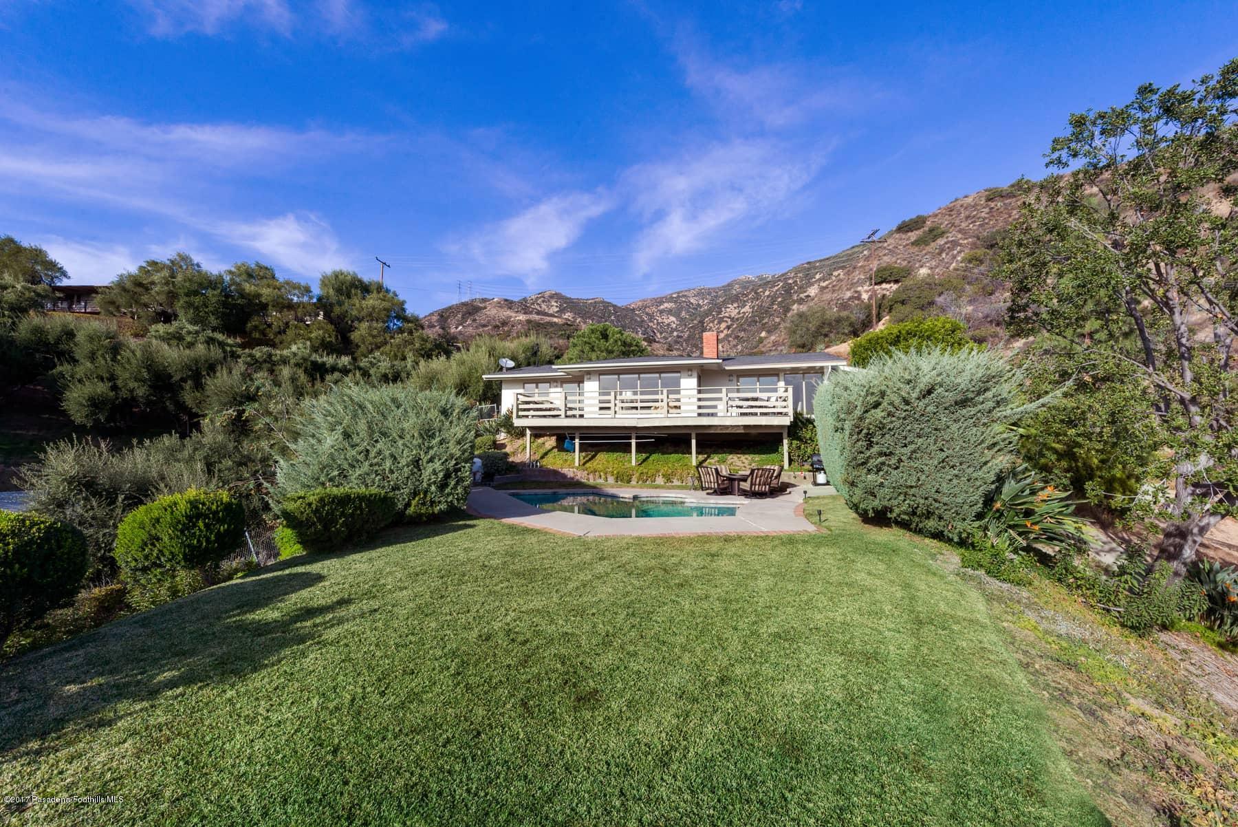 3430 Ellington Villa Drive Altadena, CA 91001 - Photo 44 of 49 a view of a big yard with a house in the background