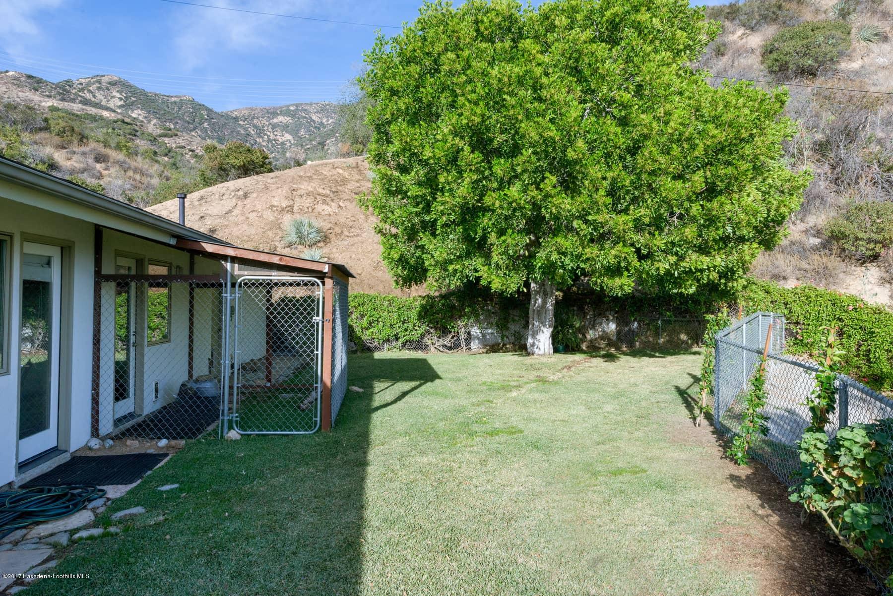 3430 Ellington Villa Drive Altadena, CA 91001 - Photo 47 of 49 front view of a house with a yard