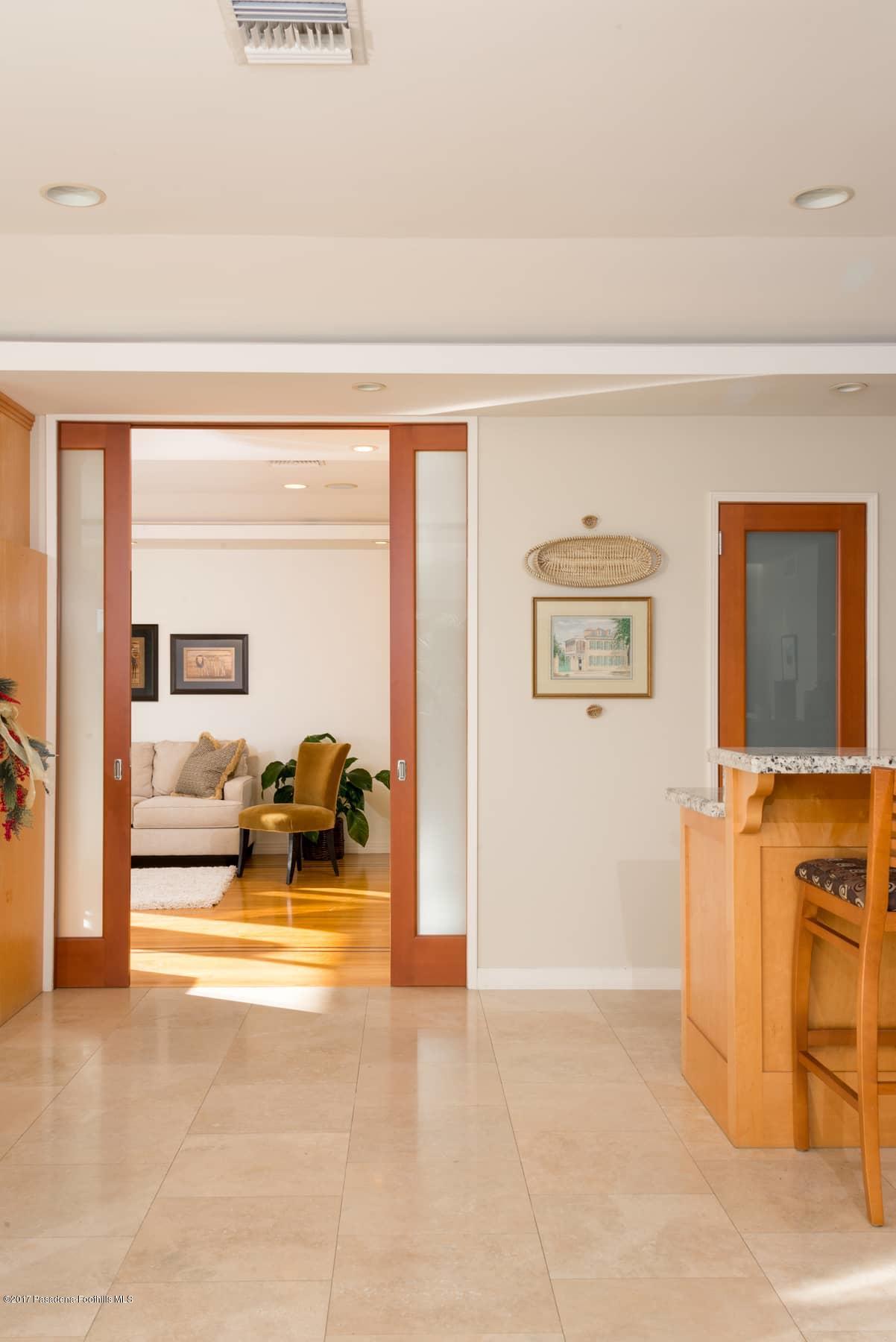 3430 Ellington Villa Drive Altadena, CA 91001 - Photo 9 of 49 a view of living room filled with furniture and a flat screen tv