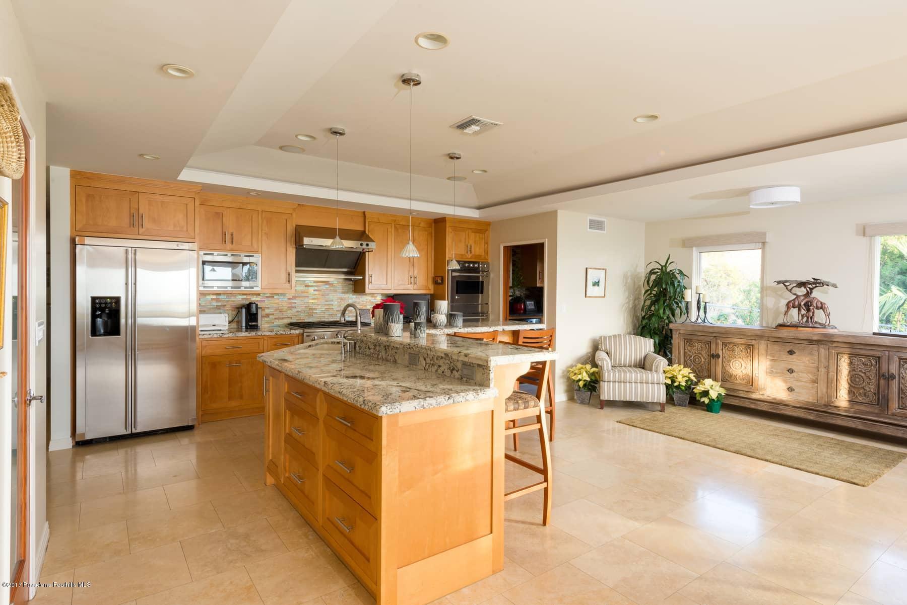 3430 Ellington Villa Drive Altadena, CA 91001 - Photo 10 of 49 a kitchen with stainless steel appliances granite countertop a stove and a refrigerator