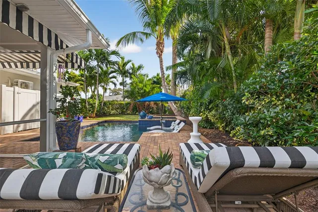 a balcony with table and chairs
