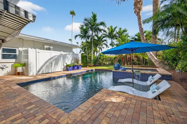 a view of a swimming pool with a patio