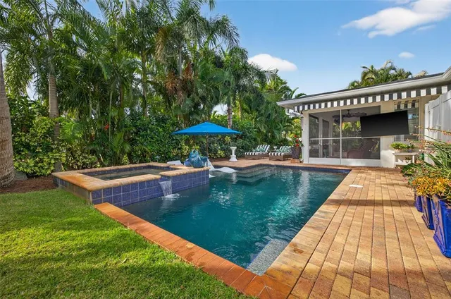 a view of a swimming pool with a patio