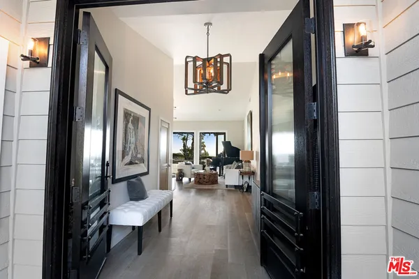a view of a livingroom with furniture and a ceiling fan