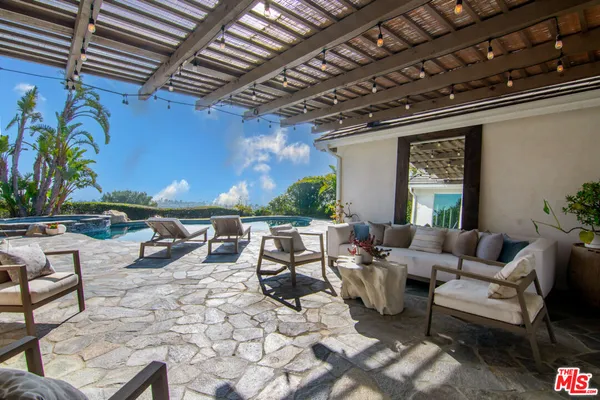 a outdoor living space with furniture and a potted plant