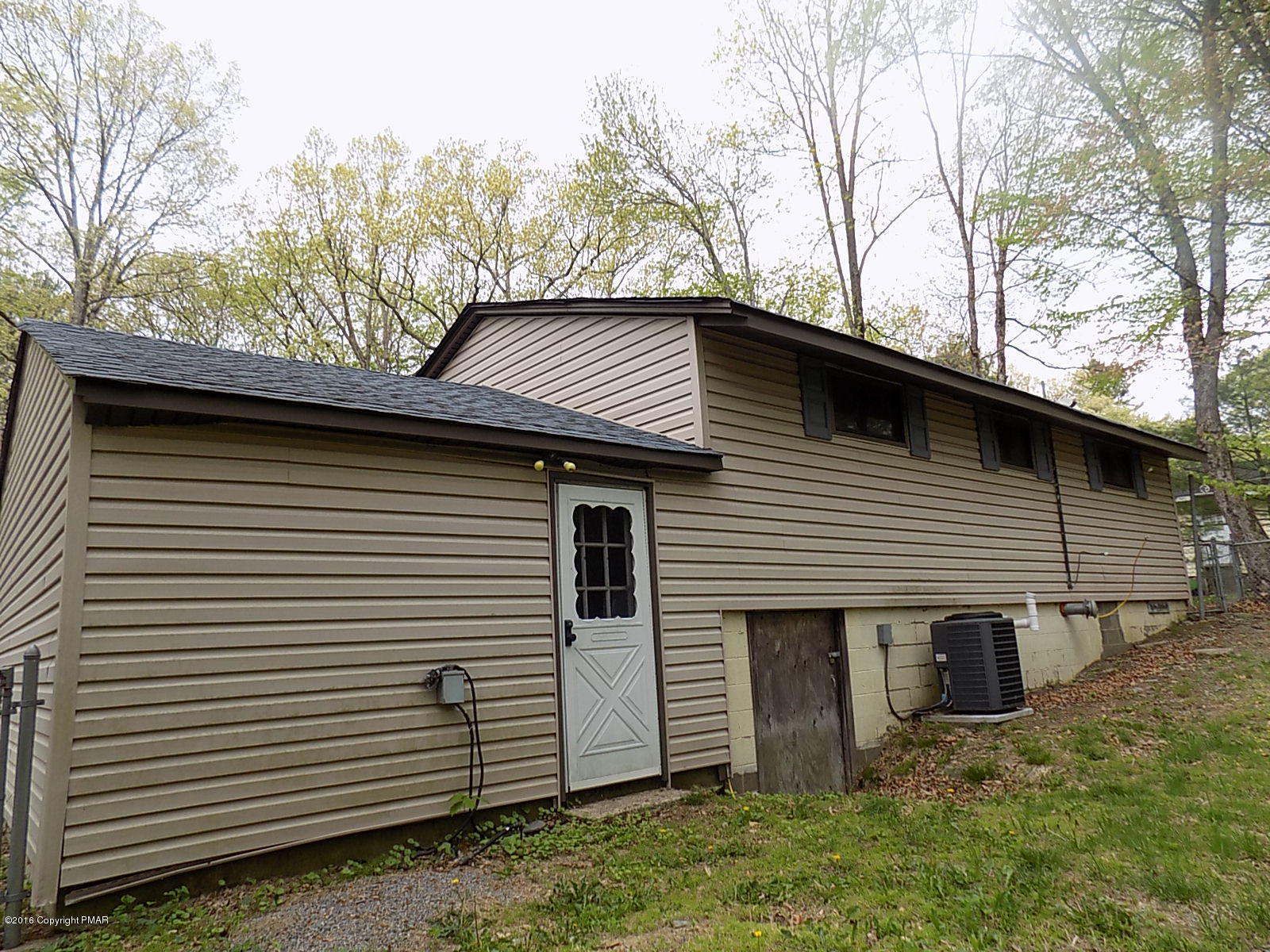 118 Beech Road Dingmans Ferry, PA 18328 - Photo 2 of 9 a view of house with backyard and trees