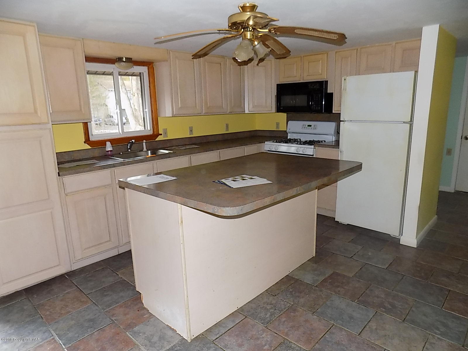 118 Beech Road Dingmans Ferry, PA 18328 - Photo 9 of 9 a kitchen with stainless steel appliances granite countertop a refrigerator a sink a stove a microwave and a refrigerator