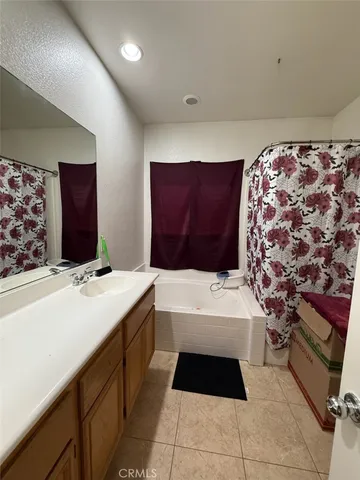 a bathroom with a bathtub and a sink