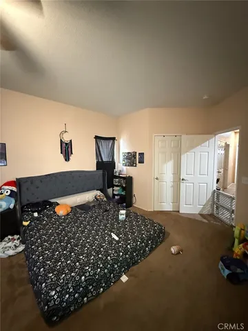 a living room with lots of furniture and gym equipment