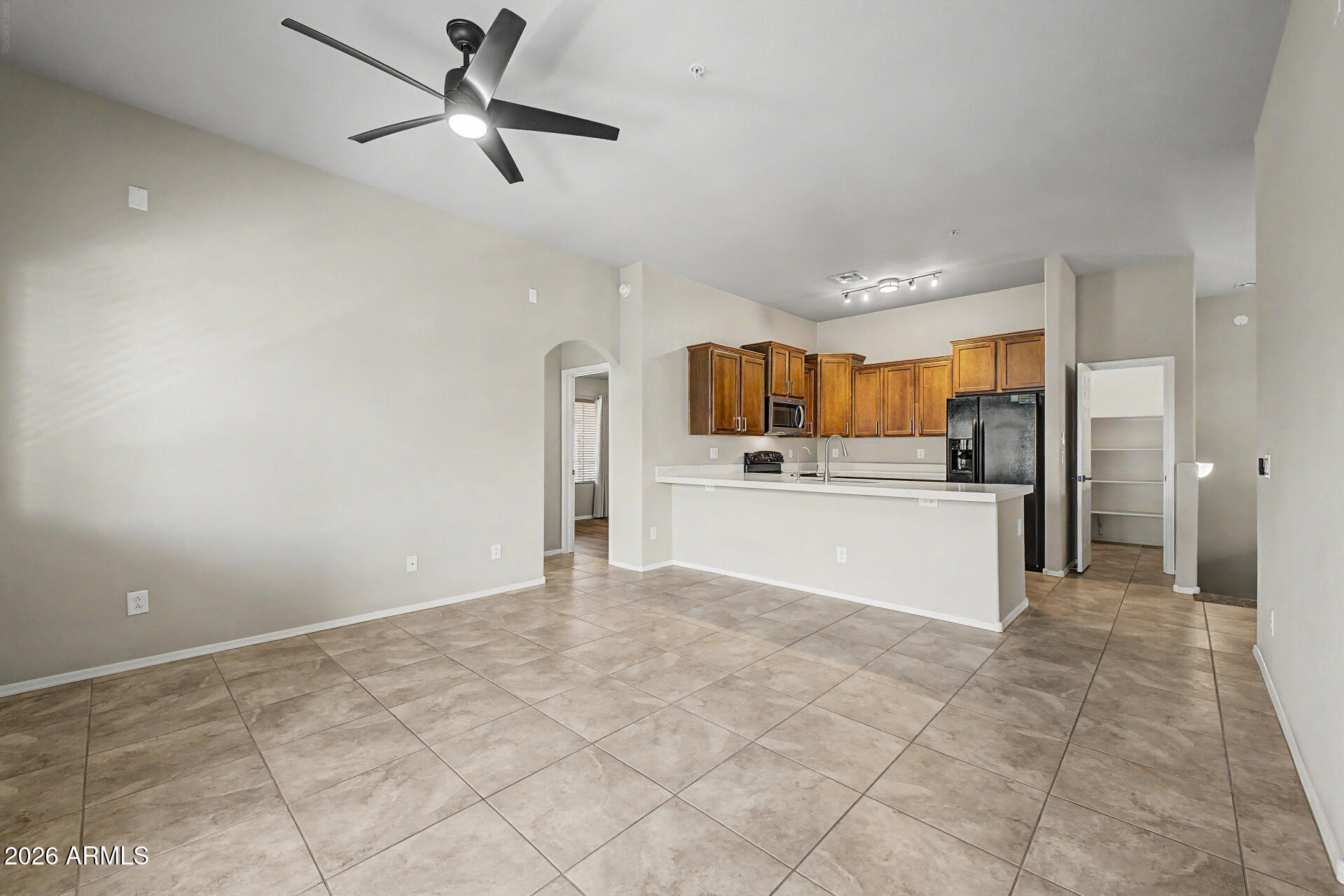 2725 East Mine Creek Road, Unit 2172 Phoenix, AZ 85024 - Photo 11 of 28 a view of kitchen with refrigerator and window