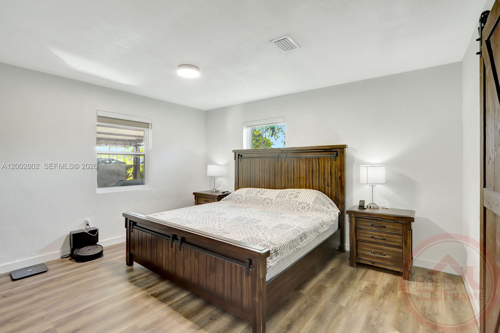 a bedroom with a bed and a dresser