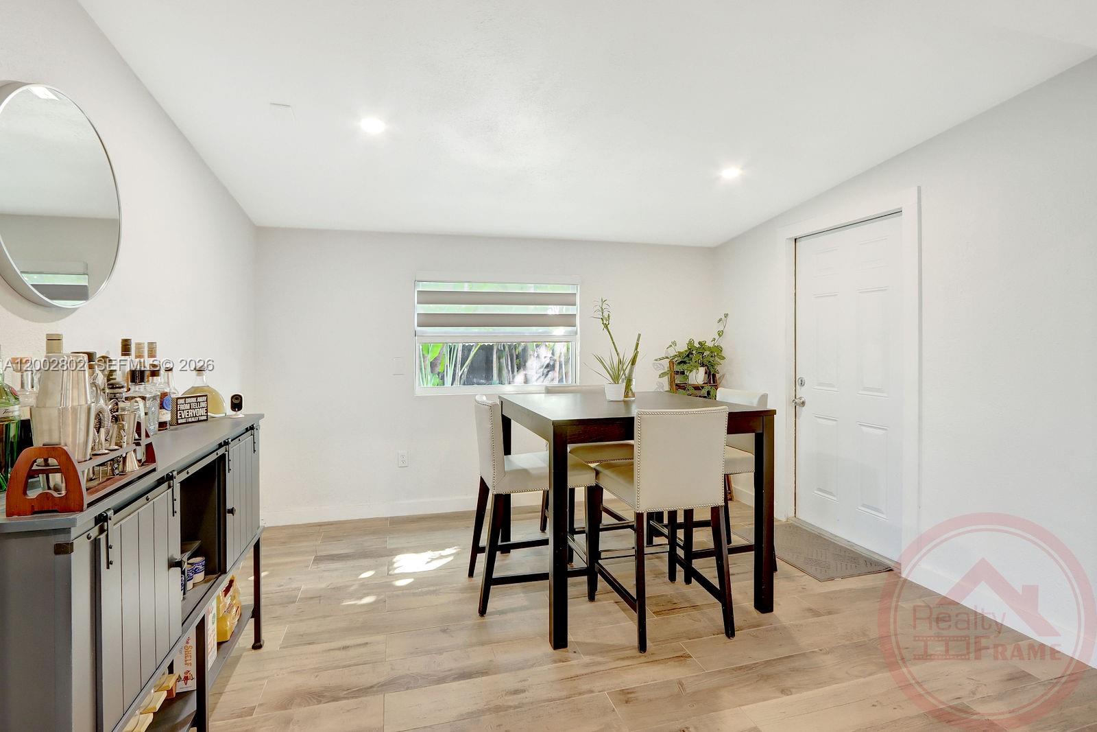 11240 Southwest 60th Terrace Miami, FL 33173 - Photo 13 of 19 a view of a dining room with furniture and wooden floor