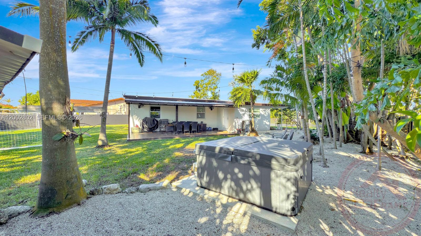 11240 Southwest 60th Terrace Miami, FL 33173 - Photo 18 of 19 a view of a house with backyard and sitting area