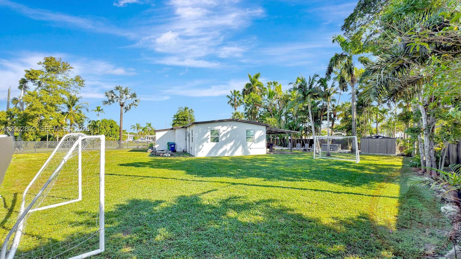 11240 Southwest 60th Terrace Miami, FL 33173 - Photo 5 of 19 a view of a swimming pool with a yard