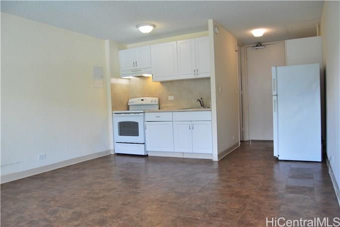 1718 Anapuni Street, Unit 502 Honolulu, HI 96822 - Photo 3 of 9 a view of kitchen with wooden floor