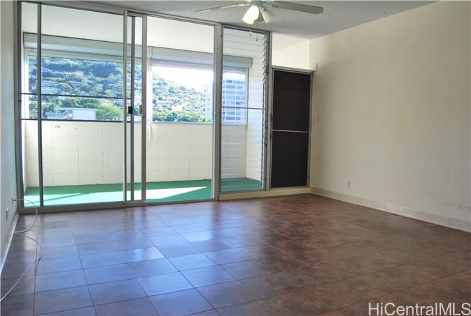 1718 Anapuni Street, Unit 502 Honolulu, HI 96822 - Photo 4 of 9 a view of an empty room with a window