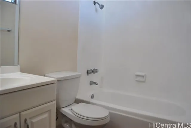 a bathroom with a sink a toilet and bathtub