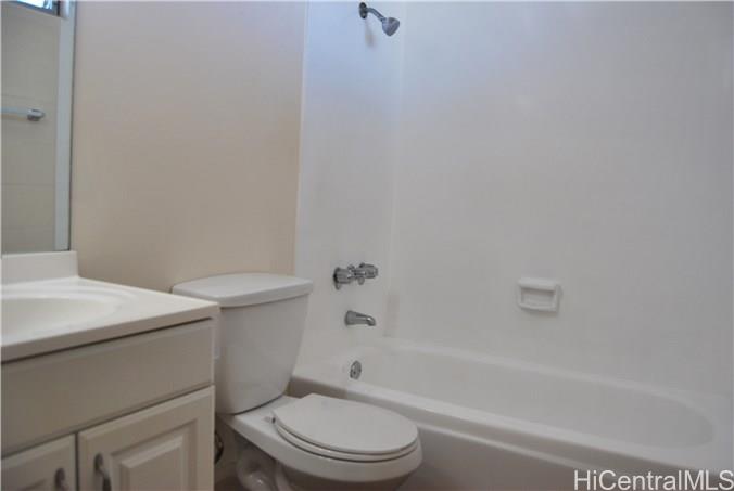 1718 Anapuni Street, Unit 502 Honolulu, HI 96822 - Photo 6 of 9 a bathroom with a sink a toilet and bathtub