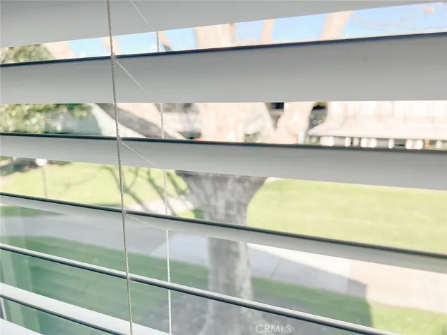 a bathroom with a sink vanity mirror and toilet