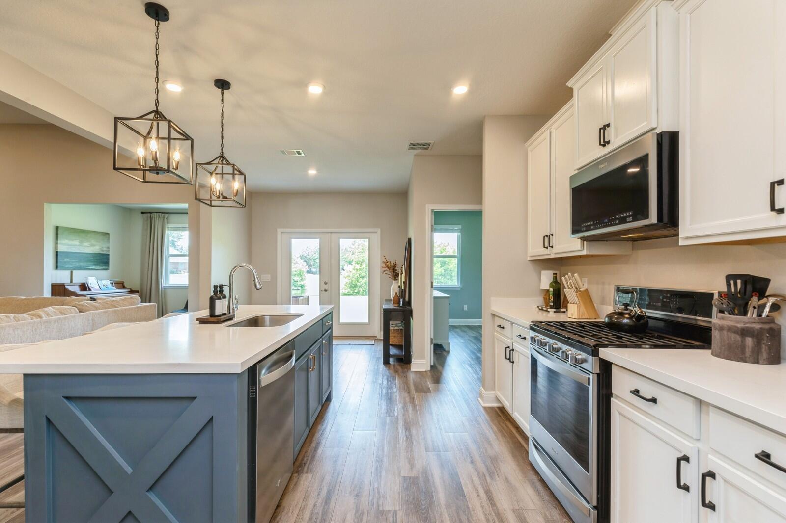 254 Concert Court Freeport, FL 32439 - Photo 15 of 69 a kitchen with stainless steel appliances granite countertop a sink a stove top oven a counter space and cabinets