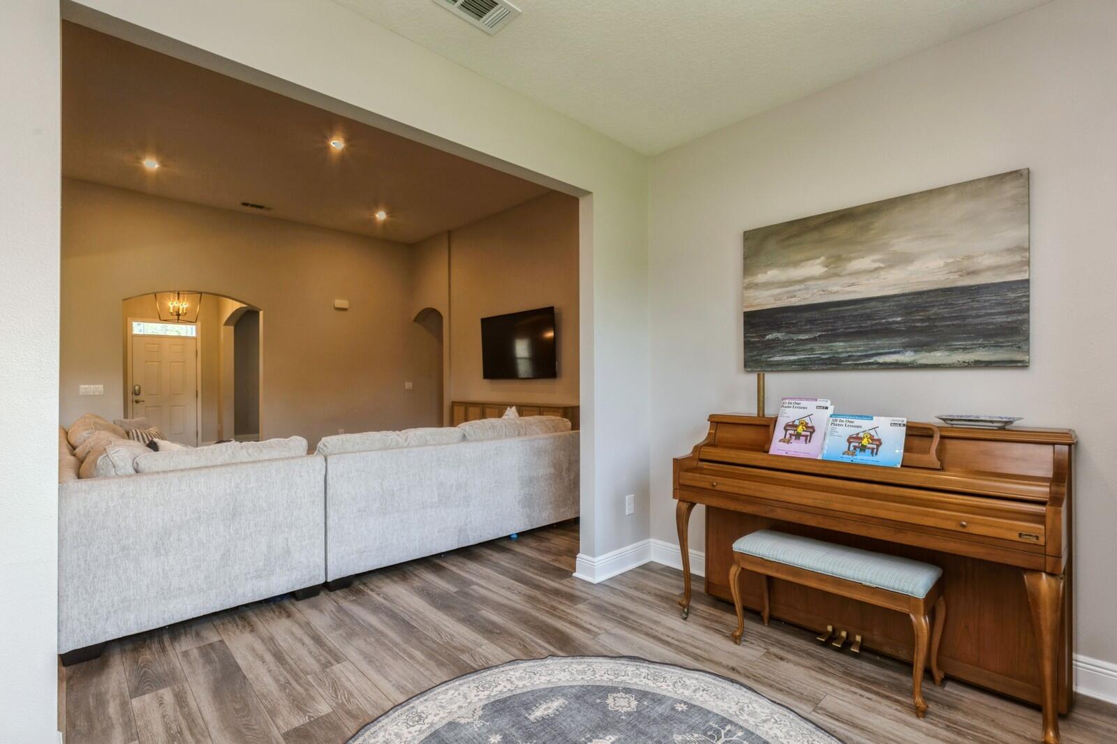 254 Concert Court Freeport, FL 32439 - Photo 16 of 69 a living room with furniture and a piano
