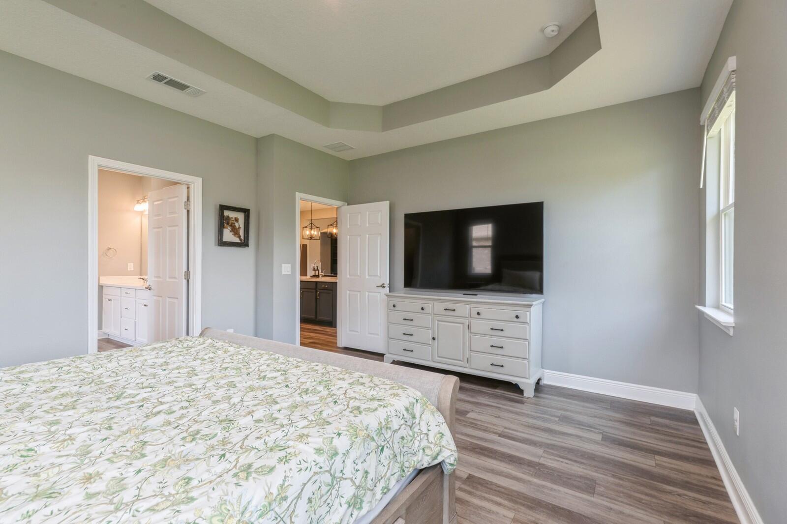 254 Concert Court Freeport, FL 32439 - Photo 20 of 69 a bedroom with a flat screen tv and a bed