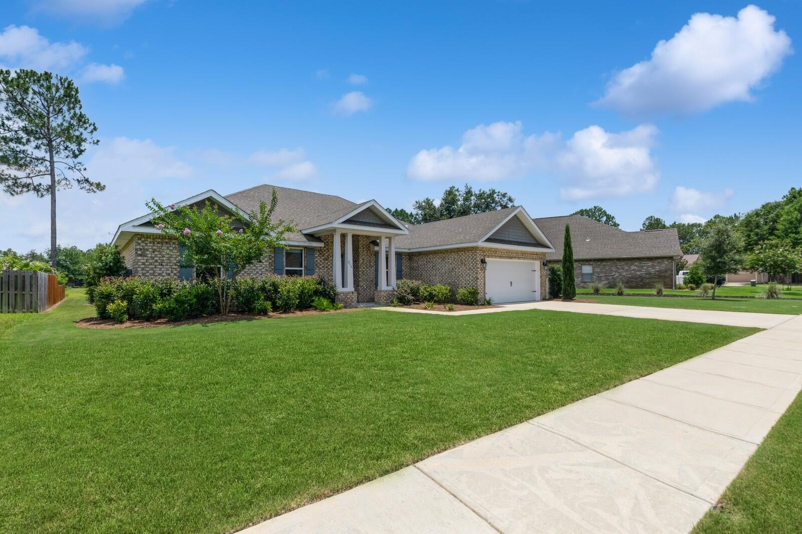 254 Concert Court Freeport, FL 32439 - Photo 2 of 69 a front view of a house with a yard