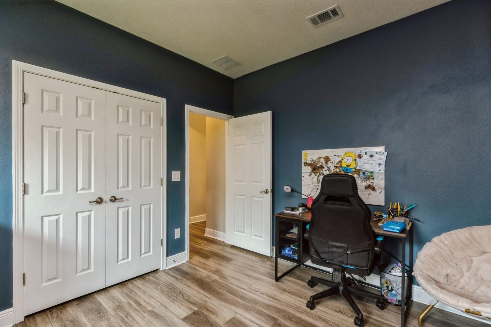 254 Concert Court Freeport, FL 32439 - Photo 27 of 69 a view of a workspace with furniture and wooden floor