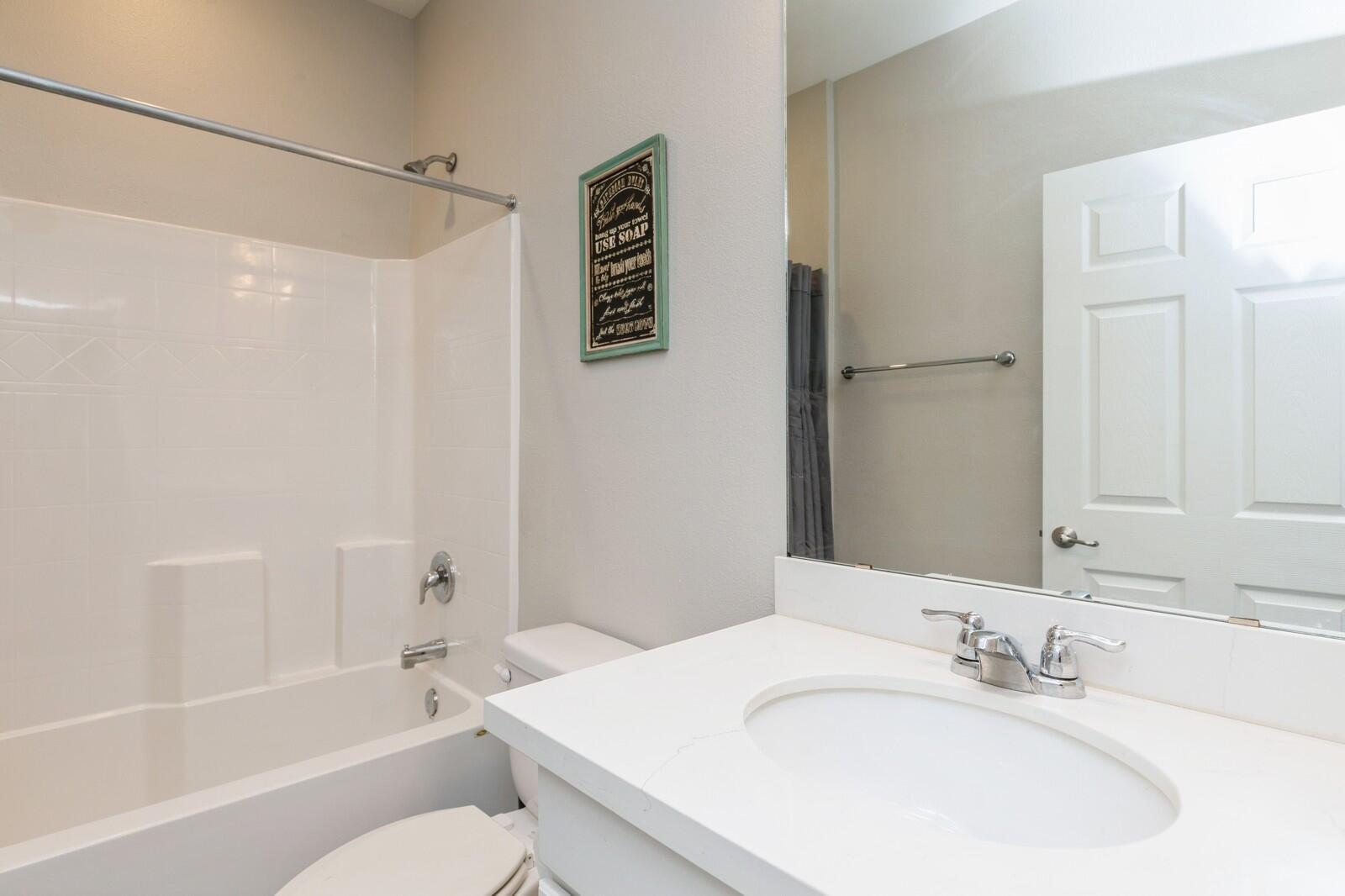 254 Concert Court Freeport, FL 32439 - Photo 31 of 69 a bathroom with a granite countertop sink toilet and shower