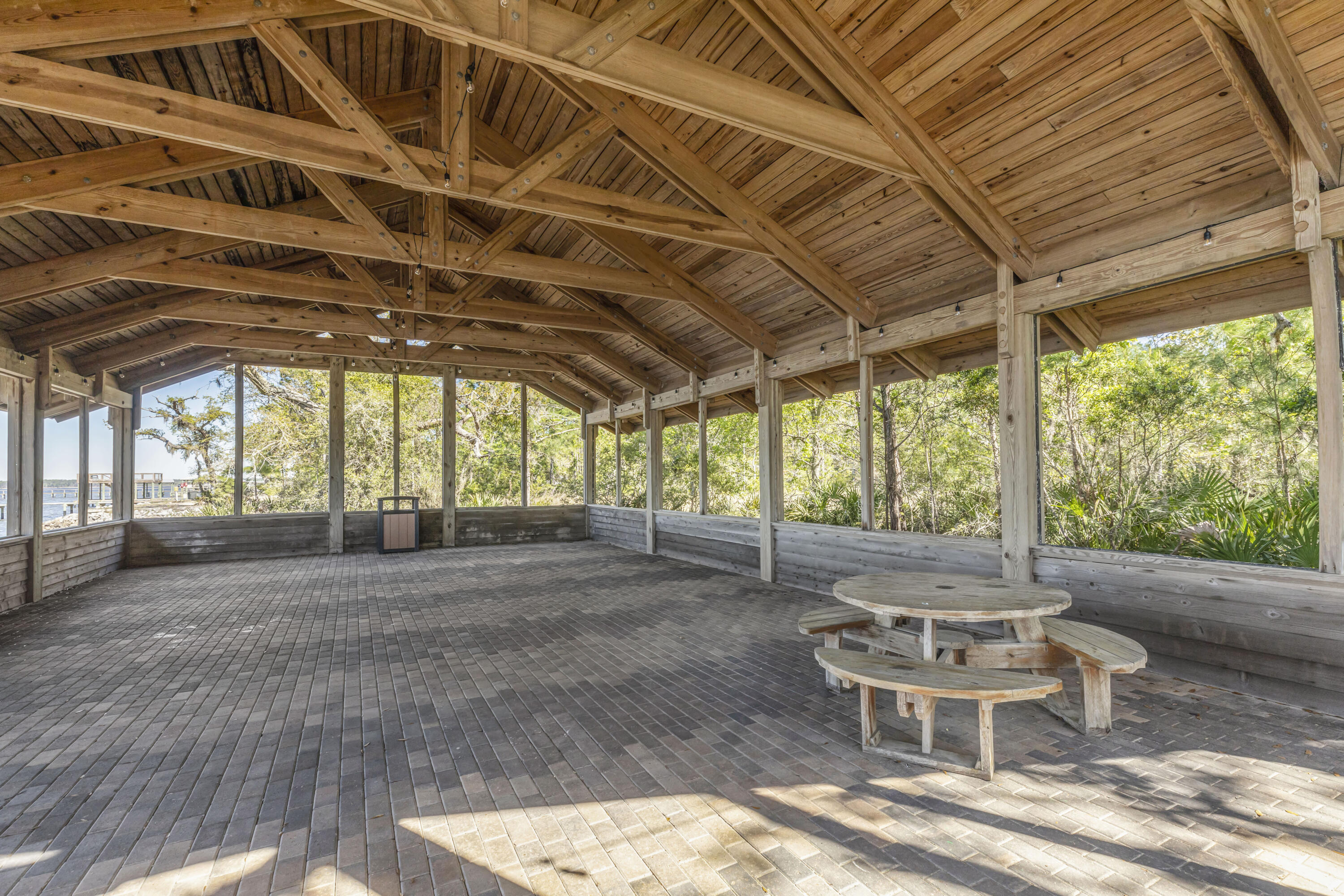 254 Concert Court Freeport, FL 32439 - Photo 63 of 69 a view of a patio with table and chairs and wooden floor