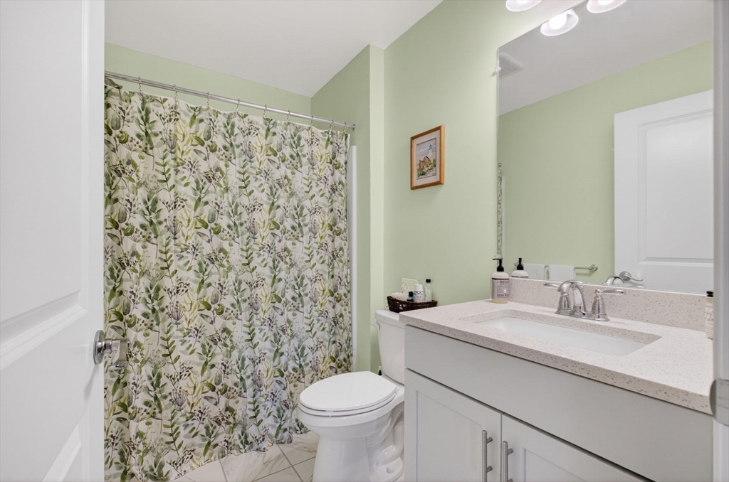 87 Shannon Way, Unit 86 Upton, MA 01568 - Photo 25 of 36 a bathroom with a sink toilet and shower