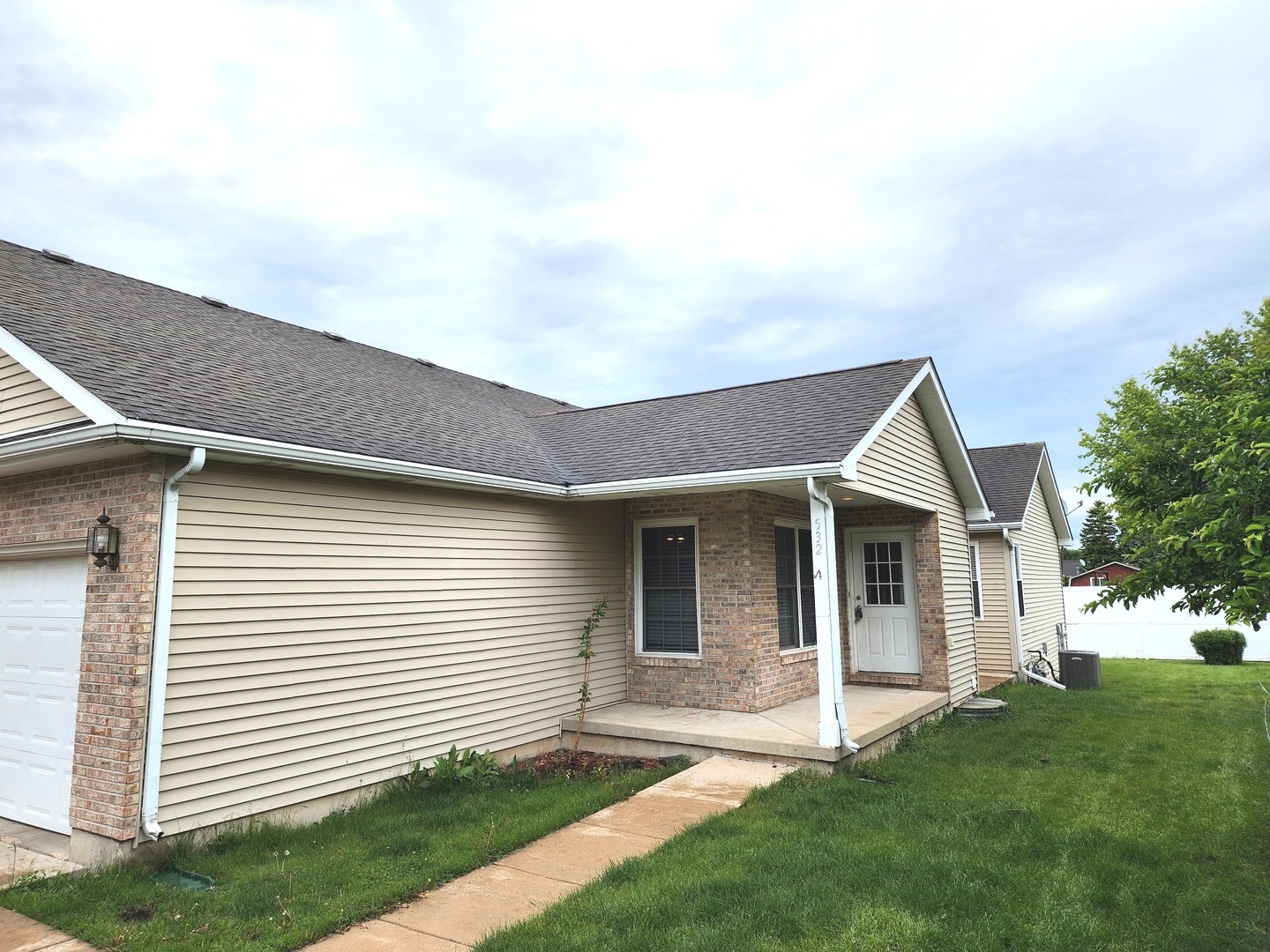 532 Elizabeth Street Maple Park, IL 60151 - Photo 2 of 14 a front view of a house with a garden