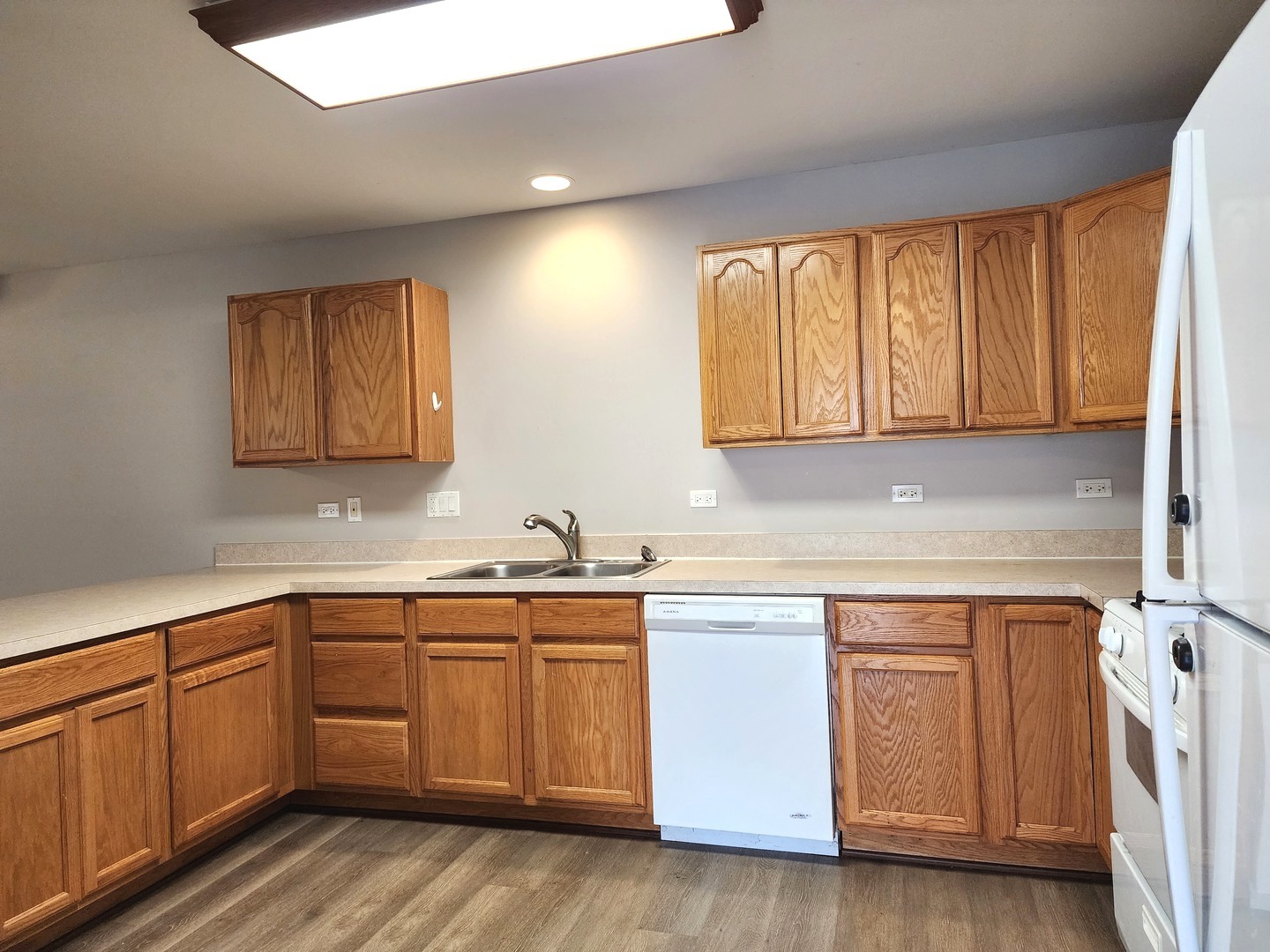 532 Elizabeth Street Maple Park, IL 60151 - Photo 9 of 14 a kitchen with a sink cabinets and wooden floor