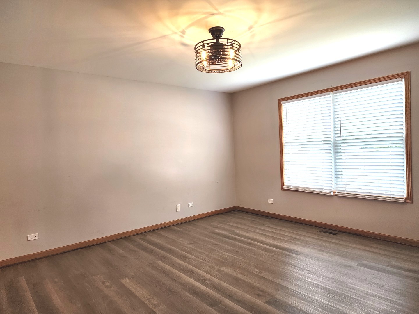 532 Elizabeth Street Maple Park, IL 60151 - Photo 10 of 14 a view of empty room with wooden floor and fan