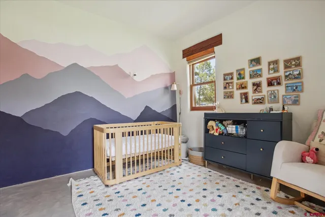 a bedroom with furniture and a window