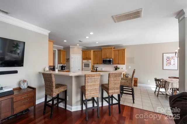 a view of a dining room with furniture kitchen and wooden floor