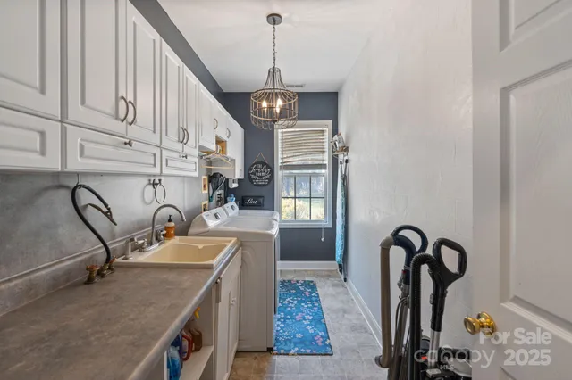 a kitchen with stainless steel appliances granite countertop a sink a stove and a wooden floors