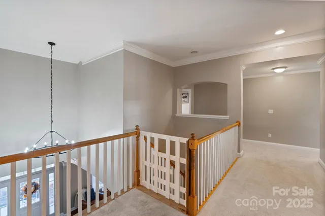 a view of a hallway with windows