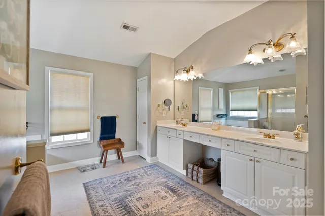 a view of a center kitchen island with furniture and wooden floor