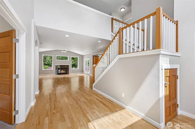 a view of living room with furniture and large windows
