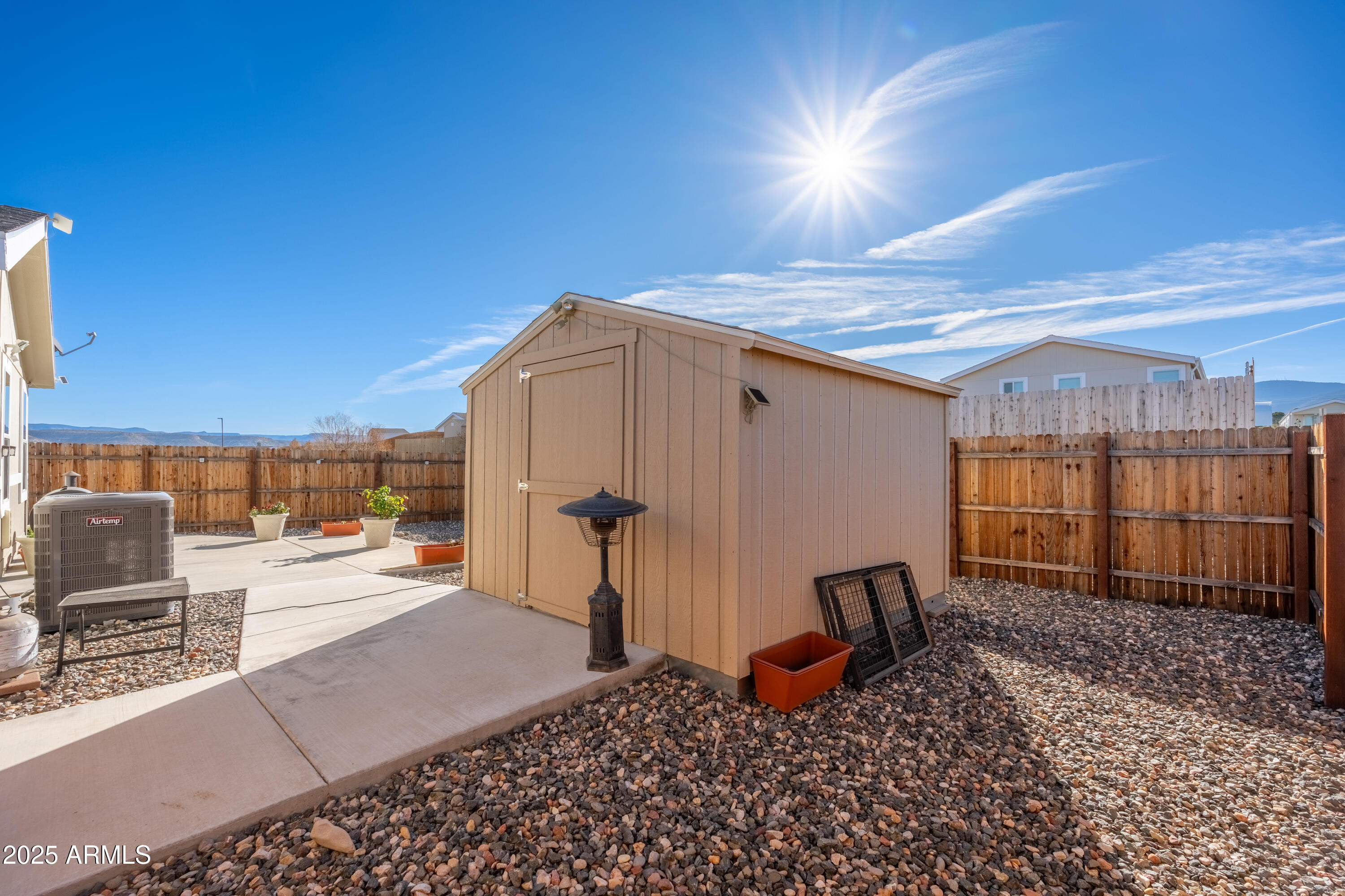 1033 Wheeler Road Camp Verde, AZ 86322 - Photo 28 of 51 a backyard of a house with barbeque oven table and chairs
