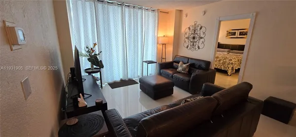 a living room with furniture and a window