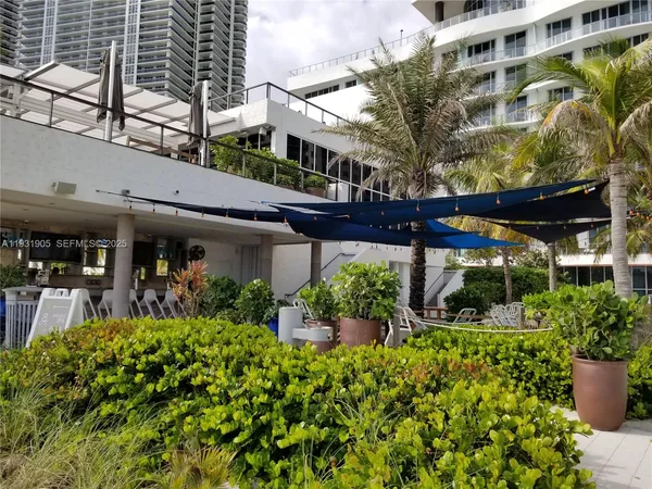a room with furniture and pool table