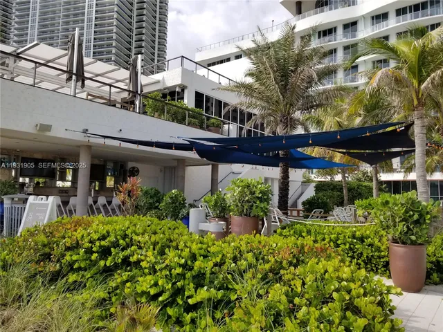 a room with furniture and pool table